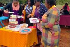 members-of-staff-cutting-50th-anniversary-cake